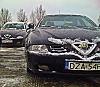 Alfa Romeo 166 2.4 JTD i 2.5 V6 w oddali.